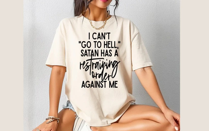 😈 I Can’t “Go to Hell”, Satan Has a Restraining Order Against Me Tee – Rebelliously Hilarious!